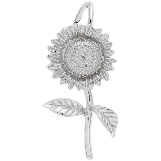 The Rembrandt Charms Sunflower Charm in sterling silver showcases detailed petals and two leaves along a slender stem. This intricately designed piece highlights the central disc of the flower and features leaves with visible veins. A loop at the top allows for easy attachment to a chain or necklace.