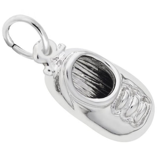 The image shows the Sterling Silver Baby Shoe Charm from Rembrandt Charms. The charm is crafted in sterling silver and depicts a detailed baby shoe. It measures 0.31 inches by 0.59 inches (7.85 mm x 15.03 mm) and has the style number 2393. This charm is a perfect keepsake for new parents and grandparents, symbolizing the joy of early childhood.