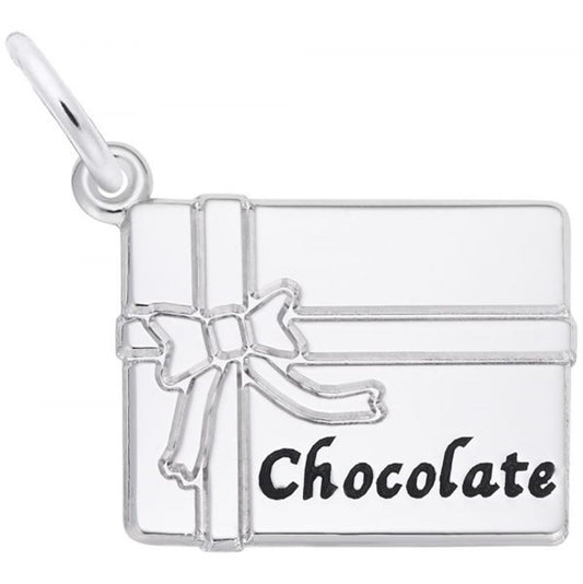 The Rembrandt Charms Chocolate Box Charm in sterling silver features a rectangular design resembling a chocolate box, complete with a ribbon and bow on the left side. The word "Chocolate" is elegantly written in black on the right, and it includes a small loop at the top left corner for easy attachment to a bracelet or necklace.