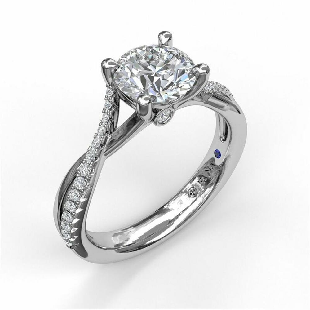 The 14K White Gold Alternating Diamond Twist Engagement Ring by FANA showcases a large round, conflict-free diamond in a prong setting, with alternating smaller diamonds along the twisted band. A small blue gemstone is intricately included on the inner part of the band. The ring is elegantly set against a white background.