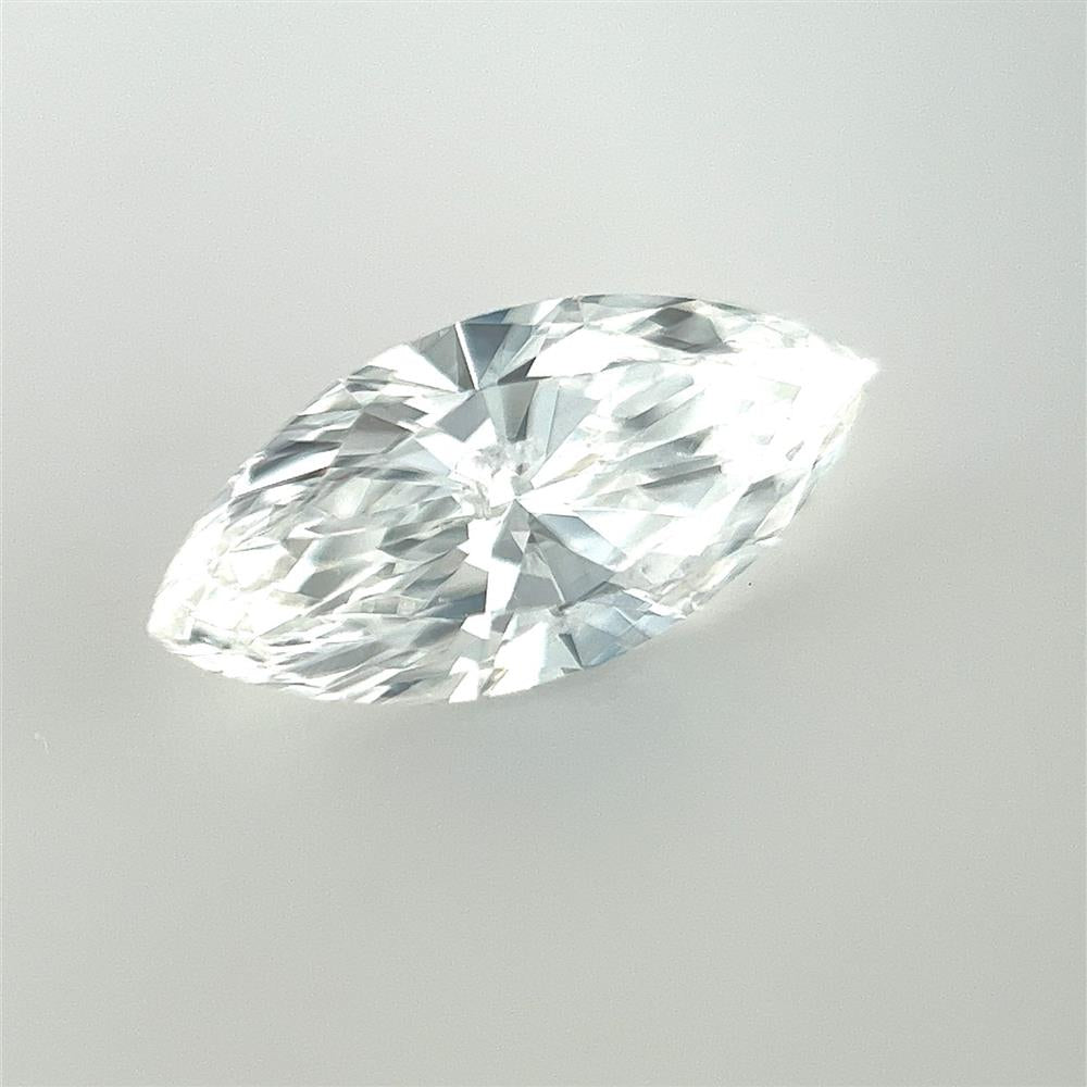 A detailed close-up image showcases the Marquise 0.92ct diamond from Cedar Trading, Inc. The marquise-cut diamond is crystal clear, with precise facets and perfect symmetry. This EGL certified natural diamond has an SI1 clarity grade and a stunning F color, brilliantly reflecting light from various angles against a simple, light background.