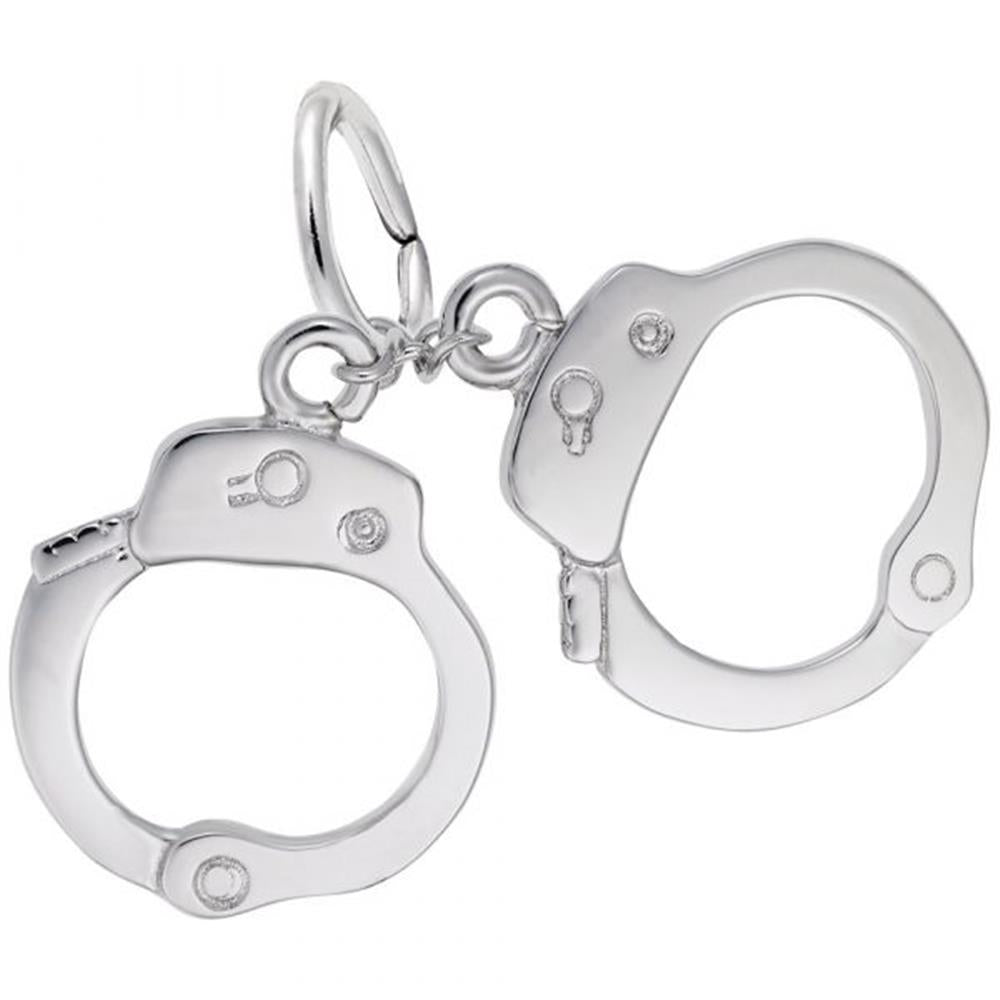 A close-up of a pair of shiny Rembrandt Charms Handcuffs Charm / Sterling Silver. The handcuffs are linked together by small chains and have intricate details, including keyholes and locking mechanisms. The design is precise, and they appear to be miniature replicas of real handcuffs.