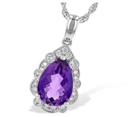 The Amythest and Diamonds 14K White Gold Necklace by Allison Kaufman features a stunning pear-shaped amethyst pendant surrounded by a dazzling diamond halo, gracefully suspended from a 14K white gold chain. This exquisite design highlights the vivid color and sparkling brilliance of the gemstones.