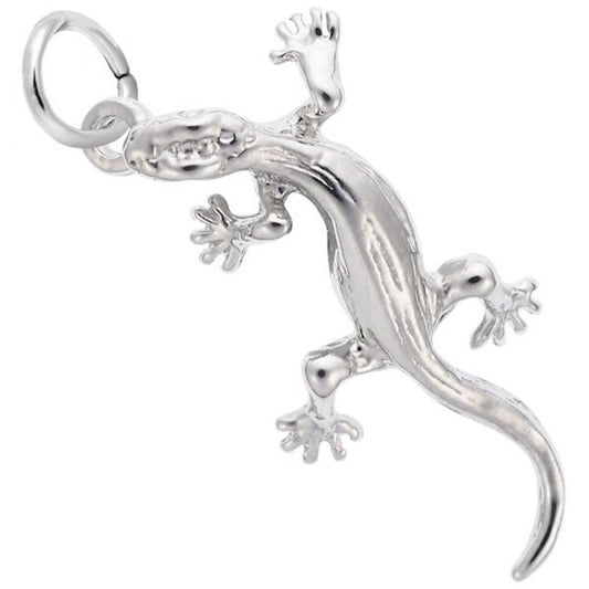 The Lizard Charm from Rembrandt Charms is crafted from sterling silver and features a realistic design with detailed limbs and tail. The charm, which depicts the lizard in an intricate crawling position, is equipped with a circular ring at the top for easy attachment to a necklace or keychain.