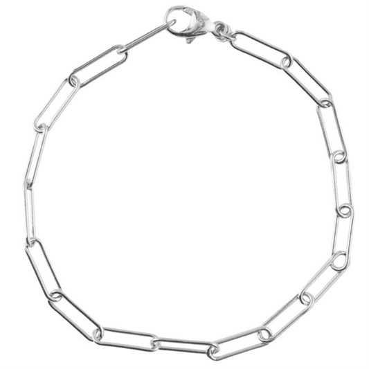 The Rembrandt Charms paperclip bracelet 7" - ss is a delicate, silver chain featuring elongated oval links in a simple, minimalist design. This 7-inch bracelet includes a small clasp for securing it around the wrist.