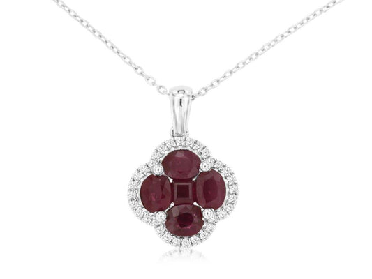 A silver chain necklace by Royal Jewelry highlights the Ruby and Diamond Clover Pendant, featuring five oval-cut gemstones arranged in a floral motif, reminiscent of rubies. The vibrant stones are surrounded by a halo of small, gleaming diamonds, adding an elegant touch to this stunning piece.