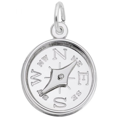 The Compass with Needle Charm in Sterling Silver by Rembrandt Charms showcases engraved directional markings (N, NE, E, SE, S, SW, W, NW) and a central rotating needle. It features a loop at the top for convenient attachment to a chain or bracelet.