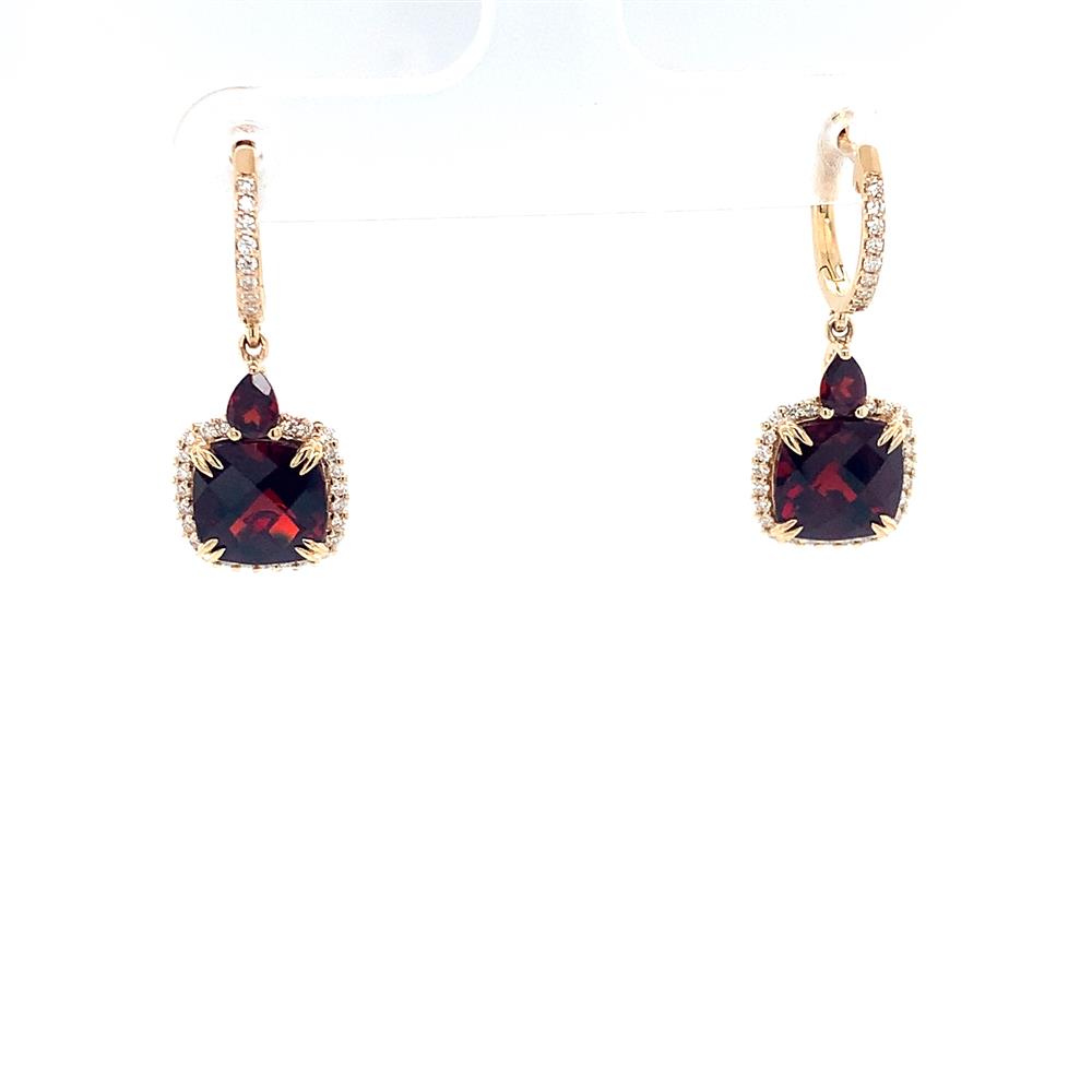 The Garnet and Diamonds Earrings by Bellarri showcase an elegant sophistication with their intricate design. Each earring features a square-cut deep red garnet, enhanced by small, sparkling diamonds and accented with a teardrop-shaped gemstone above it, all beautifully set in 14K yellow gold.