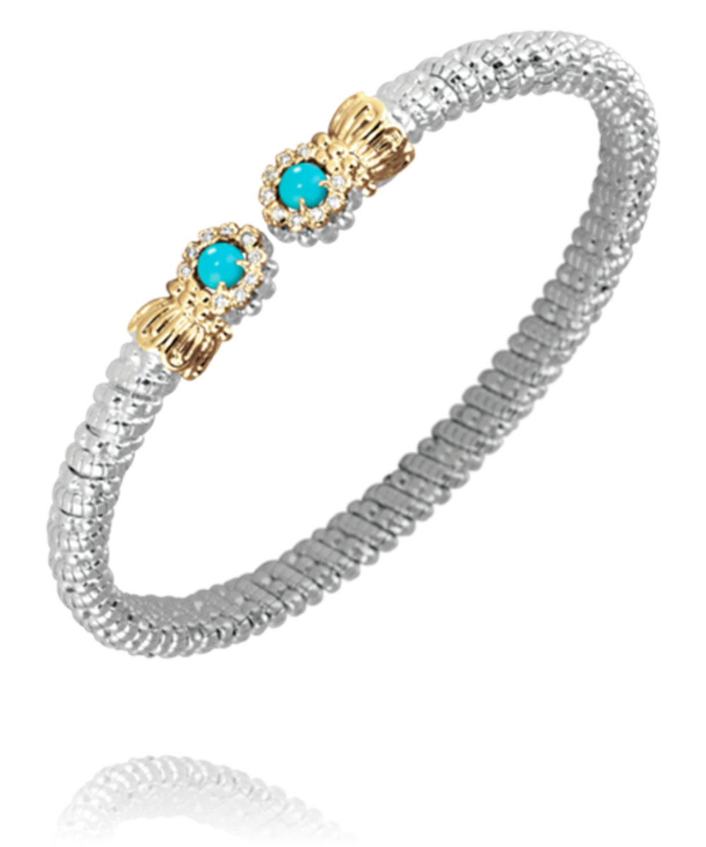 The Alwand Vahan Jewelry 4MM Turquoise bracelet showcases a silver band adorned with two gold accents. Each accent includes a 4MM turquoise stone surrounded by small white crystals, resulting in an elegant and stylish design.