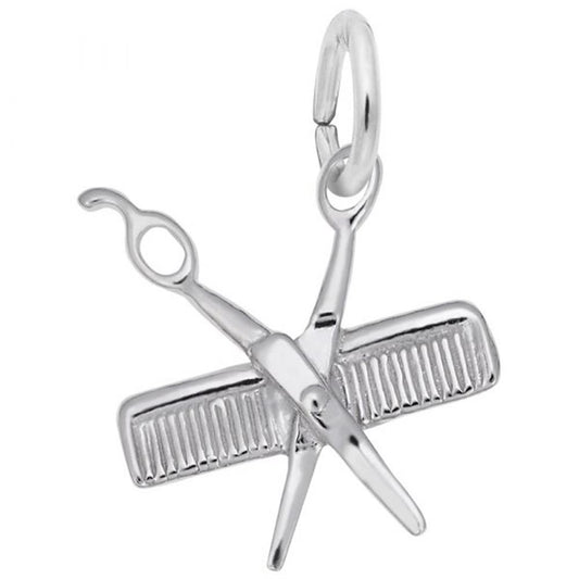 The Rembrandt Charms Comb & Scissors Charm in sterling silver features a pair of scissors crossed over a comb. It includes a small loop at the top for easy attachment to bracelets or necklaces, making it a versatile accessory.