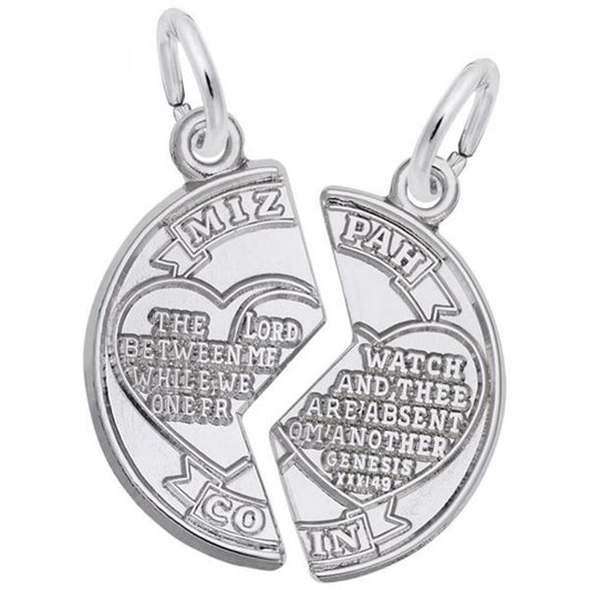 The Mizpah Charm from Rembrandt Charms, crafted in sterling silver, comes as two separate pieces. Each half of the charm features an engraved heart and a biblical verse. The left side is inscribed with "The Lord watch between me and thee when we are absent one from another," while the right side displays "Genesis XXX1:49.