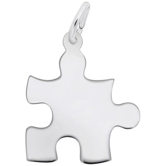 A close-up image of the Rembrandt Charms Puzzle Piece Charm in sterling silver, showcasing its sleek, polished finish and a small loop at the top for attaching to a chain or bracelet.