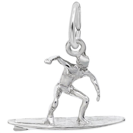 The Rembrandt Charms Surfer Charm in Sterling Silver depicts a surfer riding a surfboard in a dynamic pose, balancing with one arm raised and the other holding on. The pendant includes a loop at the top for easy attachment to a chain or bracelet.