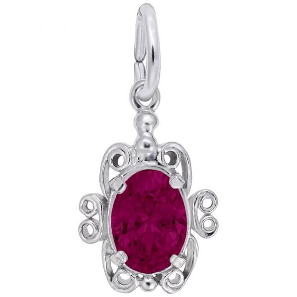 A silver pendant shaped like a turtle, featuring an oval-cut, deep red ruby birthstone at its center. The gemstone is surrounded by intricate silver filigree scrollwork forming the turtle's shell, legs, and head. A loop at the top is for attaching this stunning Filigree July Stone Charm / Sterling Silver from Rembrandt Charms to a chain.