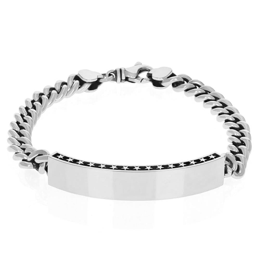 The ID and Stars Silver Bracelet by King Baby is a sleek silver link chain bracelet featuring a polished rectangular plate bordered with small stars along the top and bottom edges. This elegant accessory boasts a clasp closure for secure wear.