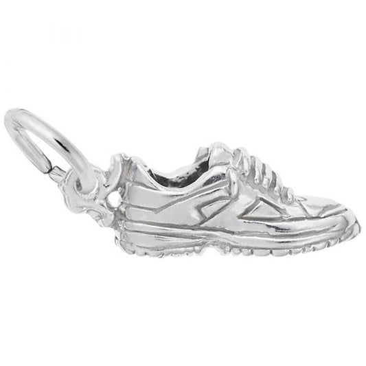 The Sneaker Charm in Sterling Silver by Rembrandt Charms is a small piece featuring detailed laces, tread, and a loop at the back for attaching to a chain or bracelet.