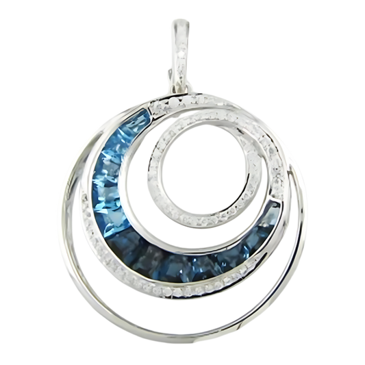 A silver pendant from Bellarri's Blue Topaz and Diamond Pearl Enhancer collection features an elegant spiral design. The spiral includes segments inlaid with shimmering blue topaz gemstones. The intricate metalwork adds a sophisticated touch to the modern and stylish accessory.