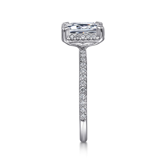 Side view of the 14K White Gold Diamond Engagement Ring from Gabriel & Co's Classic Collection, featuring a rectangular diamond. The band is crafted in 14K white gold and embellished with small diamonds, creating an elegant and sparkling design that prominently showcases the diamond.