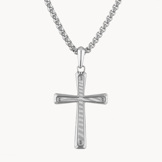 The Bulova Sterling Silver and Damascus Steel Cross Necklace by the Bulova Watch Company features a sterling silver cross pendant with a textured pattern, displayed on a matching silver chain. The cross has rounded edges and is attached by a small loop, underscoring the simple yet elegant design.