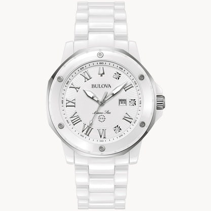 A Bulova Watch Company Marc Anthony Marine Star Watch featuring a white ceramic band and case. The watch has a silver bezel, a white dial with silver Roman numerals, diamond hour markers, and luminescent hands. The dial also includes a date display and the Bulova logo near the 12 o'clock position.