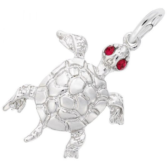 Introducing the Turtle Charm from Rembrandt Charms: a meticulously crafted sterling silver turtle-shaped pendant featuring intricate detailing on the shell and limbs. This exquisite charm is adorned with two red, gem-like stones for eyes and includes a small attached clasp at the top for easy hanging.