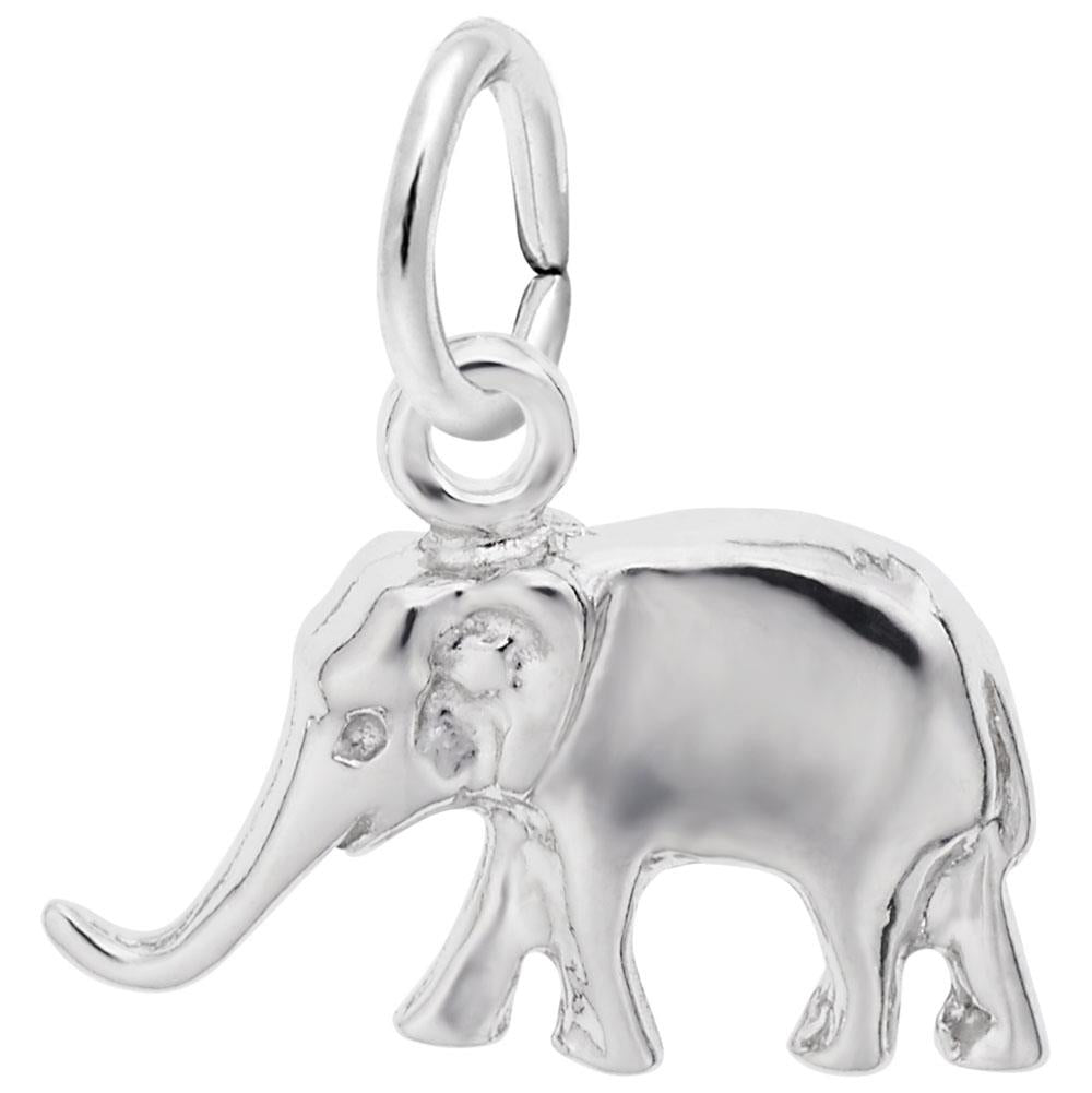 This unique piece, the Small Elephant - Sterling Silver Charm by Rembrandt Charms, is crafted from sterling silver with a smooth, polished finish. It features exquisite details such as a long trunk, large ears, and a curled tail, along with a small loop at the top for easy attachment to your chain or bracelet.