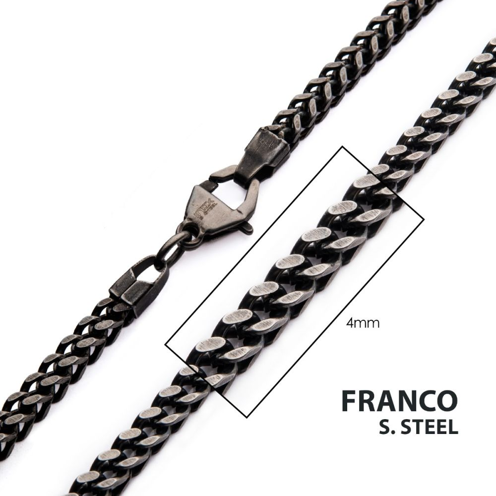 Close-up image of the 4mm Oxidized Steel Franco Chain Necklace by INOX, made of stainless steel. The chain is looped on one end with a clasp at the other. A box highlights the texture, labeled "4mm". The text "FRANCO S. STEEL" is at the bottom right.