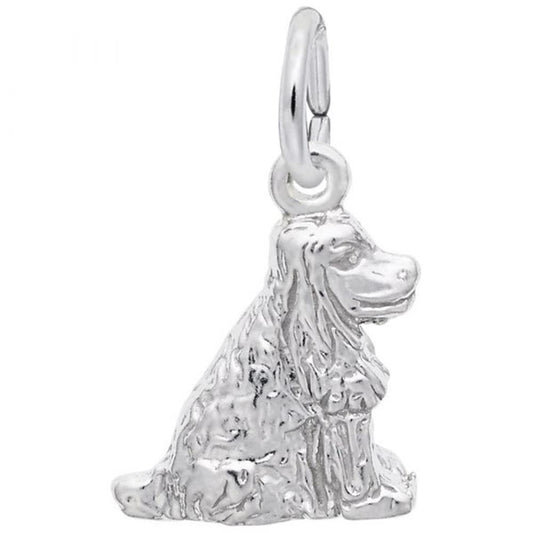 The Rembrandt Charms Cocker Spaniel Dog Charm in sterling silver features a sitting Cocker Spaniel with detailed fur and floppy ears, complete with a loop at the top for easy attachment to a chain or bracelet.