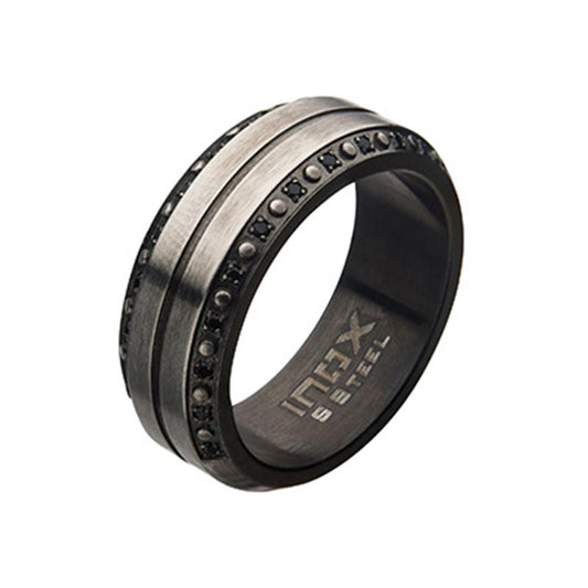 An industrial-style Matte Gunmetal Center Ridge Men's Stainless Steel Ring by INOX features a wide silver band adorned with 24 pieces of 1mm black stones embedded around its circumference. The inner part of this Black CZ Ring is inscribed with the text "INHX STEEL.