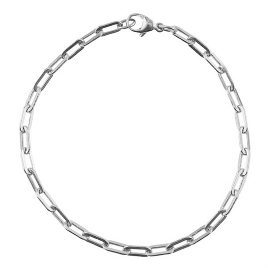 A delicate Rembrandt Charms bracelet, named "paperclip SMALL 7' - ss," features a silver chain with an oval link design resembling a paperclip pattern and is secured with a small lobster clasp, beautifully displayed on a white background.