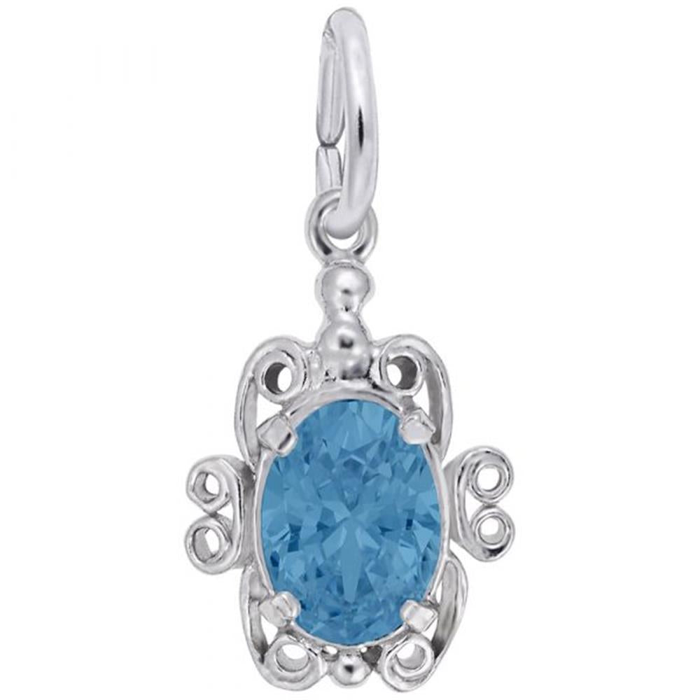 Rembrandt Charms' Filigree December Stone Charm is a sterling silver, turtle-shaped pendant featuring an oval blue topaz shell, adorned with intricate filigree detailing of curled and swirling designs around the gemstone, and includes a small loop at the top for easy attachment to a necklace or bracelet.