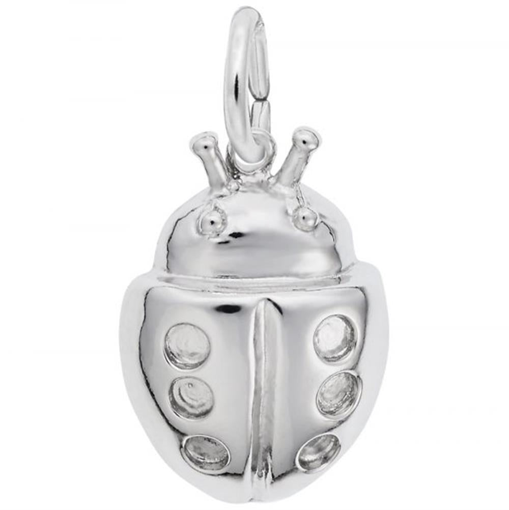 The Ladybug Charm in sterling silver by Rembrandt Charms is a small, intricately detailed piece with engraved antennae, eyes, and six circular spots on the wings. It includes a loop at the top for easy attachment to a bracelet or necklace. The charm is displayed against a white background.