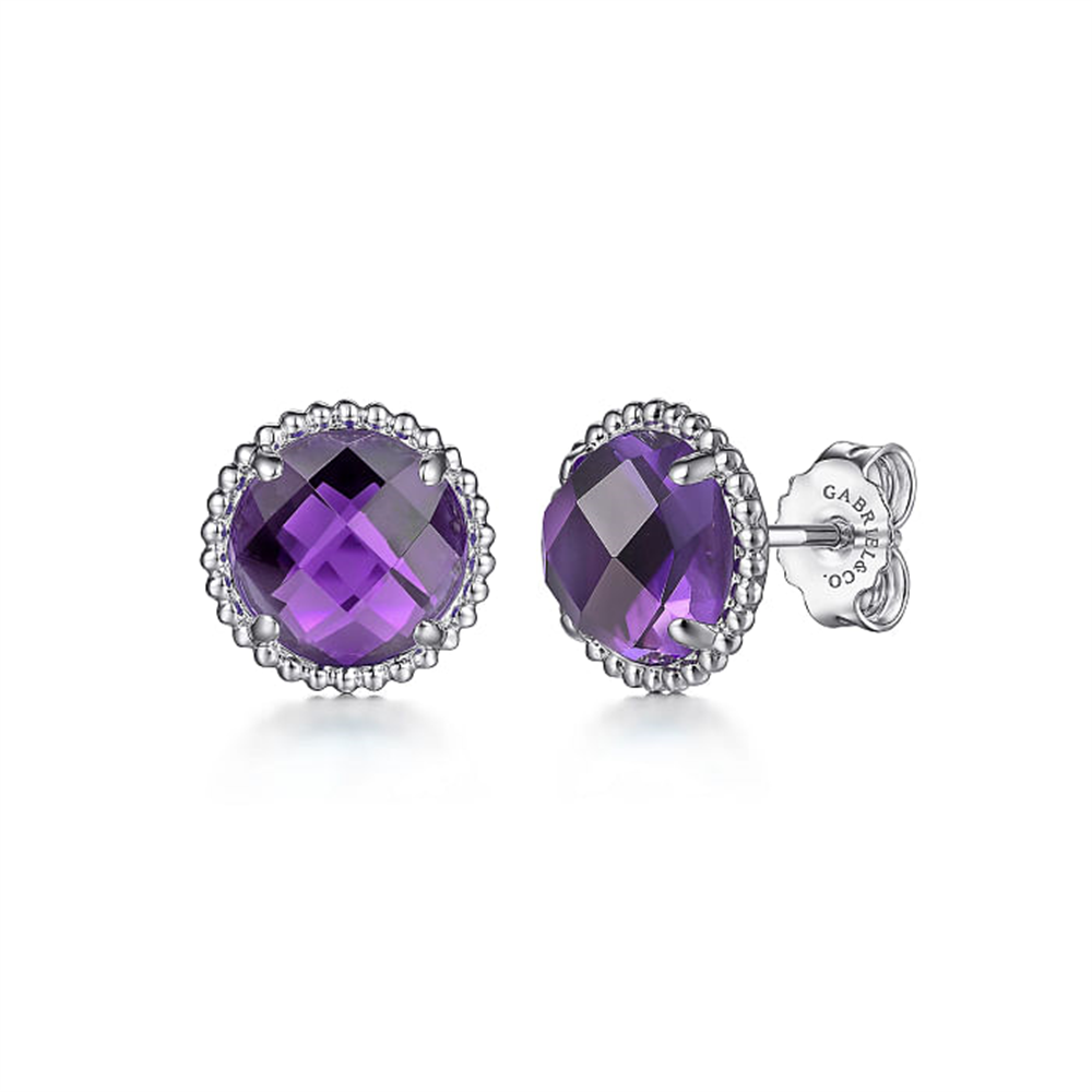 Experience the elegance of the Gabriel & Co 925 Sterling Silver Bujukan Amethyst Stud Earrings from the Bujukan Collection, featuring round, faceted amethyst stones set in intricately detailed sterling silver settings and secured with butterfly clasps.