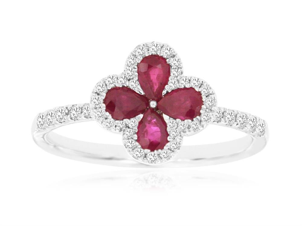 Introducing the Royal Jewelry 14k WG Ruby and Diamond Ring in size 6.75, this stunning piece features a captivating four-petal flower design. The petals are elegantly adorned with pear-shaped ruby gemstones and surrounded by small, clear stones extending to the band. Crafted from luxurious 14k white gold, it offers a sophisticated silver sheen that enhances its exquisite charm.