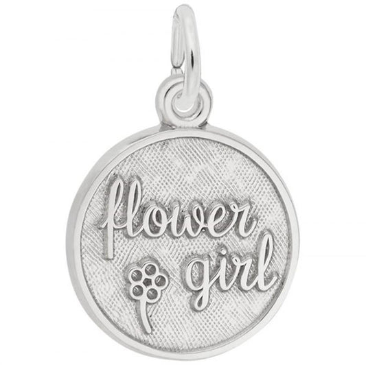 The Flower Girl Disc Charm by Rembrandt Charms is a round sterling silver piece featuring the words "flower girl" engraved in elegant script. Below the text, there's a small engraved flower design on a textured background. The pendant includes a loop at the top, allowing it to be attached to a necklace or bracelet.