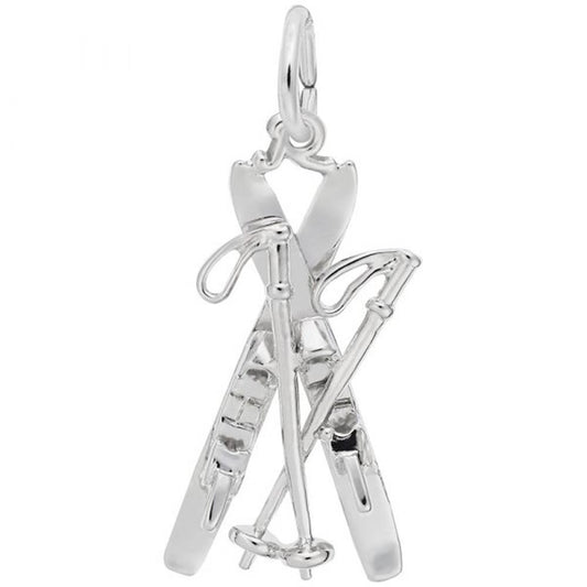 The Skis Charm in Sterling Silver by Rembrandt Charms features a pair of crossed skiing poles and skis forming an "X" shape. This charm includes a small loop at the top for easy attachment to a necklace or bracelet, and showcases intricate details such as bindings on the skis and grips on the poles, typical of Rembrandt Charms' craftsmanship.