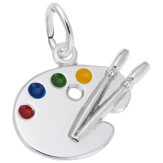 The Rembrandt Charms Petite Artist Palette Charm in Sterling Silver features four small colored paint blobs (blue, red, green, yellow) and two paintbrushes resting in the center. The pendant has a small loop at the top for hanging on a chain.