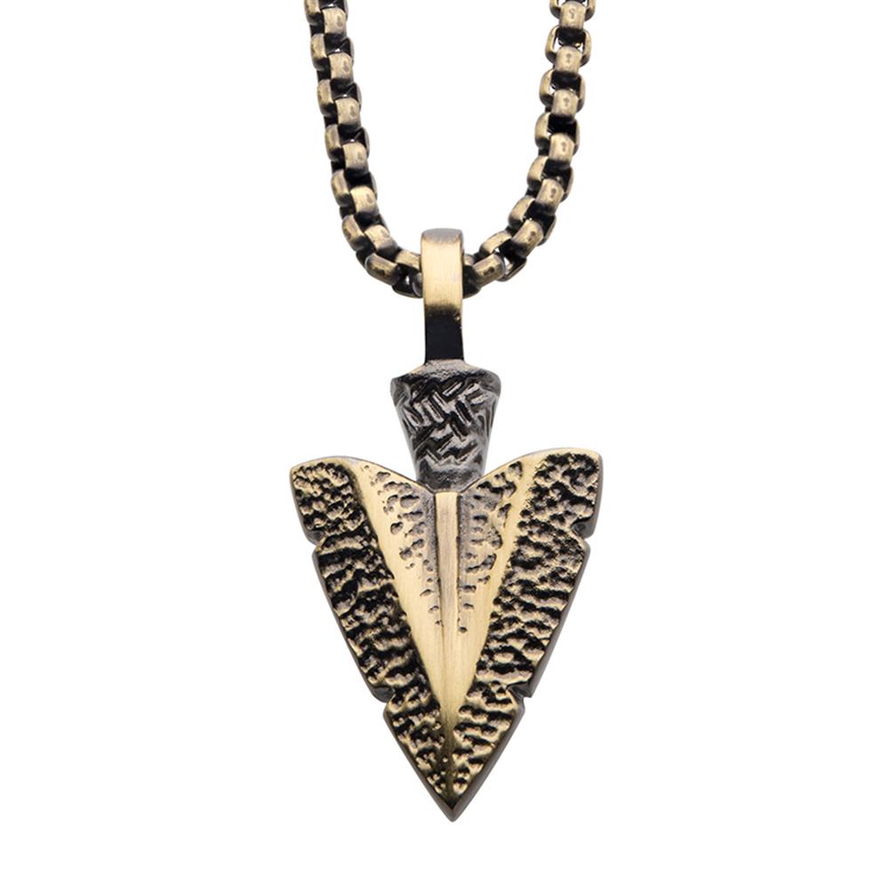 The Antiqued Gold IP Arrowhead Pendant with Bold Box Chain by INOX showcases an antiqued gold plated arrowhead pendant adorned with intricate textured details, suspended from a bold box chain. The arrowhead boasts a rugged, antique appearance, giving it a rustic and timeless charm.