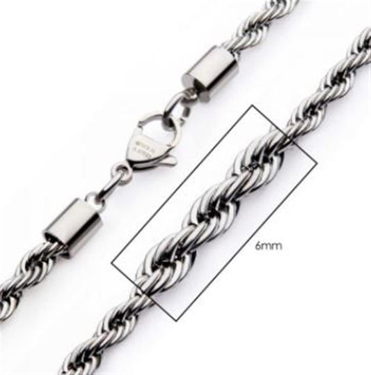 A close-up image of the INOX 6mm Steel Rope Chain Necklace, showcasing a lobster clasp. A rectangular overlay highlights a 6mm section of the chain, indicating its thickness. The intricate twisted design of the links is prominently displayed. This piece measures 20 inches in length.