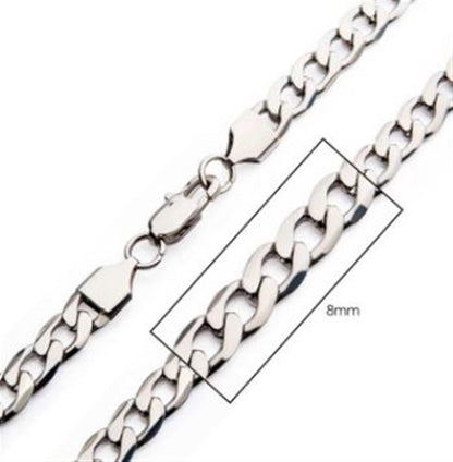 A close-up image of the 8mm Steel Bevel Curb Chain necklace from INOX showcases its stainless steel composition and lobster claw clasp. The thick, interlocked links measure 8mm in width, and a magnified section highlights the beveled curb chain design, making it an ideal men's accessory for any occasion.