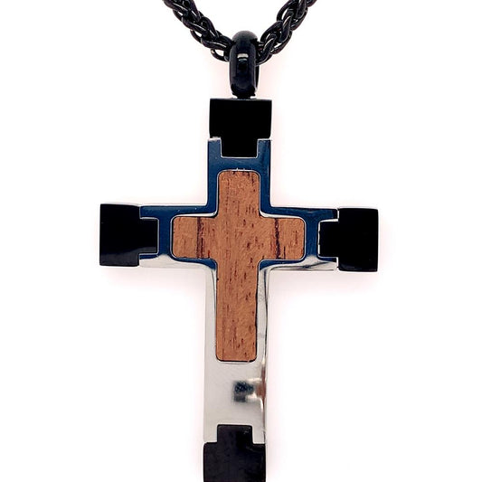 An INOX Steel Cross Pendant with a walnut wood inlay at the center, accented by sleek black and silver metallic elements, hanging from a black wheat chain.