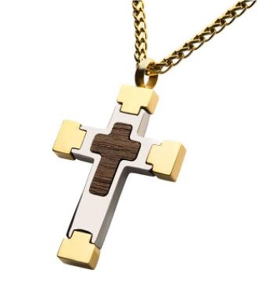 The INOX 18K Gold Plated Cross Pendant with Walnut Wood Inlay features a two-toned design with an 18K gold-plated cross accompanied by a smaller wooden cross at its center. The pendant is bordered by a silver cross with gold accents on all four ends, creating a stylish and unique appearance. It comes with a 24" long, 18K gold-plated wheat chain.