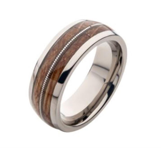 The INOX Clear Resins & Whiskey Barrel Wood Inlay Titanium Ring in size 12 features a polished silver titanium band, highlighted by a strip of whiskey barrel wood texture at the center, framed by two thin metallic grooves. This ring seamlessly blends classic elegance with rustic charm.