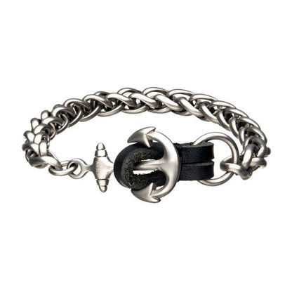 Introducing the Stainless Steel and Antiqued Finish Anchor with Black Leather Chain Bracelet by INOX: a nautical-themed accessory featuring a sturdy stainless steel anchor clasp. This stylish piece combines silver chain links with black leather straps, making the anchor both an eye-catching element and the fastening mechanism, perfect for a maritime-inspired look.