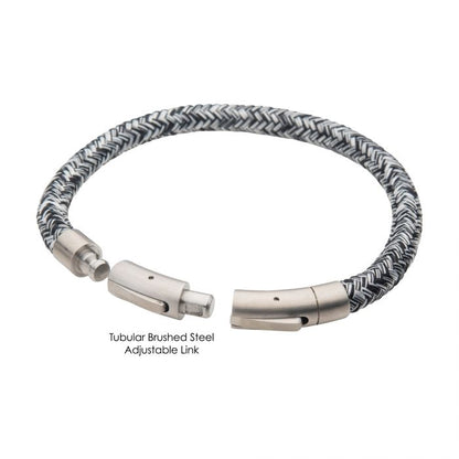 The INOX 6mm Black and White Nylon Cord Bracelet, with an adjustable length of 8-8.5 inches, is a stylish men's accessory featuring a tubular brushed steel link and a woven nylon cord. Its sleek press clasp adds a modern touch, making it both functional and fashionable.