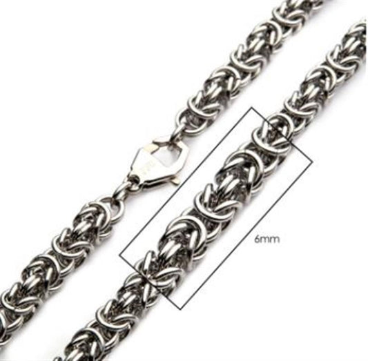 Close-up of the 6mm Steel King Byzantine Chain by INOX, a men's stainless steel necklace featuring an intricate Byzantine chain design with interlocking rings. A highlighted 6mm measurement showcases the chain's thickness. A lobster clasp is visible on the left side, making this exceptional piece of men's jewelry stand out.