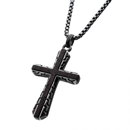 The Antique Gun Metal Sepulchre Genuine Ebony Wood Inlayed Cross Pendant by INOX hangs from a sleek gun metal box chain. The chain features a pattern of small, uniformly shaped links. The overall design of the necklace is modern and sophisticated, enhanced by a matte finish.