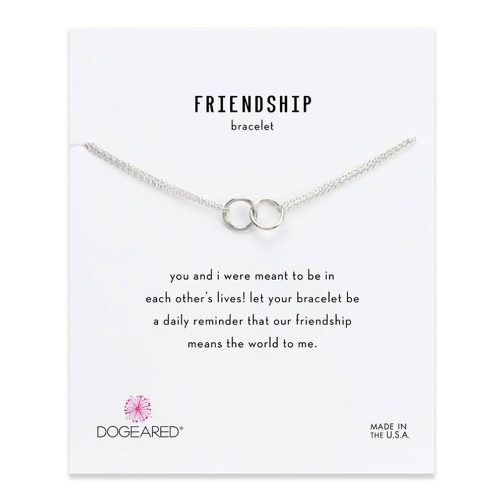 A silver Dogeared Friendship Double Linked Rings bracelet is displayed on a white card. The card reads, “FRIENDSHIP bracelet. You and I were meant to be in each other’s lives! Let your bracelet be a daily reminder that our friendship means the world to me. Made in the U.S.A.”