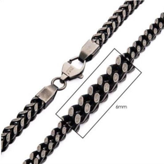 A close-up image of the INOX 8mm Oxidized Steel Franco Chain Necklace with a lobster clasp and a measurement box indicating a width of 8mm. The clasp is shown in the open position, revealing its metal finish and design.