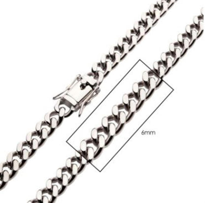 A close-up image of the 6mm Steel Miami Cuban Chain | 22" | INOX necklace shows a detailed view of the clasp and a section of the stainless steel chain. A rectangular outline highlights a portion of the men's necklace, indicating its width, labeled "6mm.